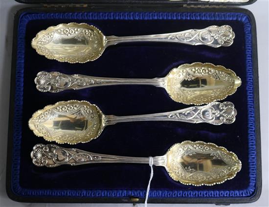 A cased set of four Edwardian silver ornate serving spoons, Mappin & Webb, Sheffield, 1903, 14 oz.